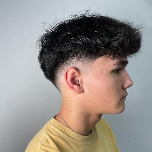 Textured top with a tapered low fade, cut by Giancarlo Colombo