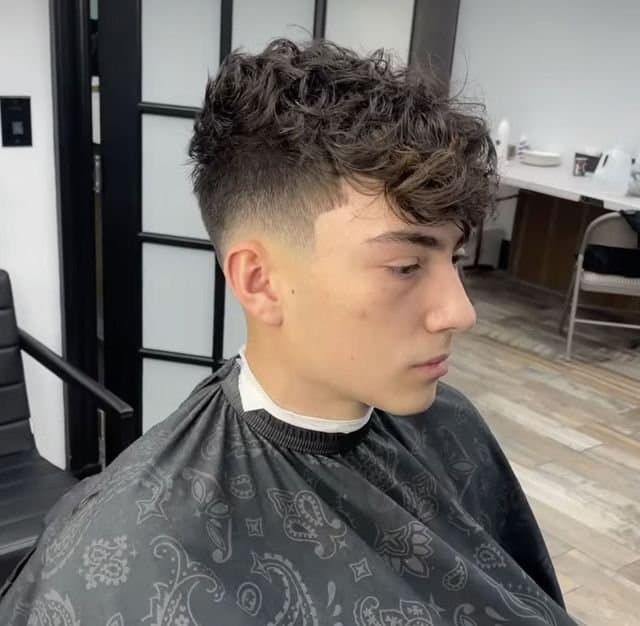 Curly fringe with a mid drop fade, cut by Giancarlo Colombo